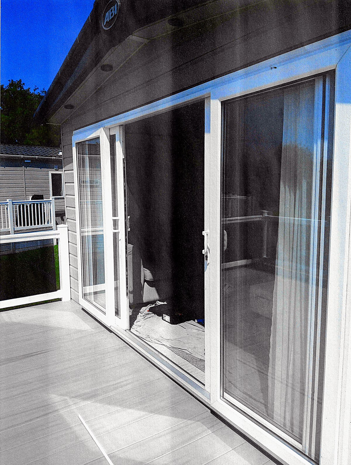A set of white UPVC patio doors on a static caravan in Cornwall, recently repaired by Rob